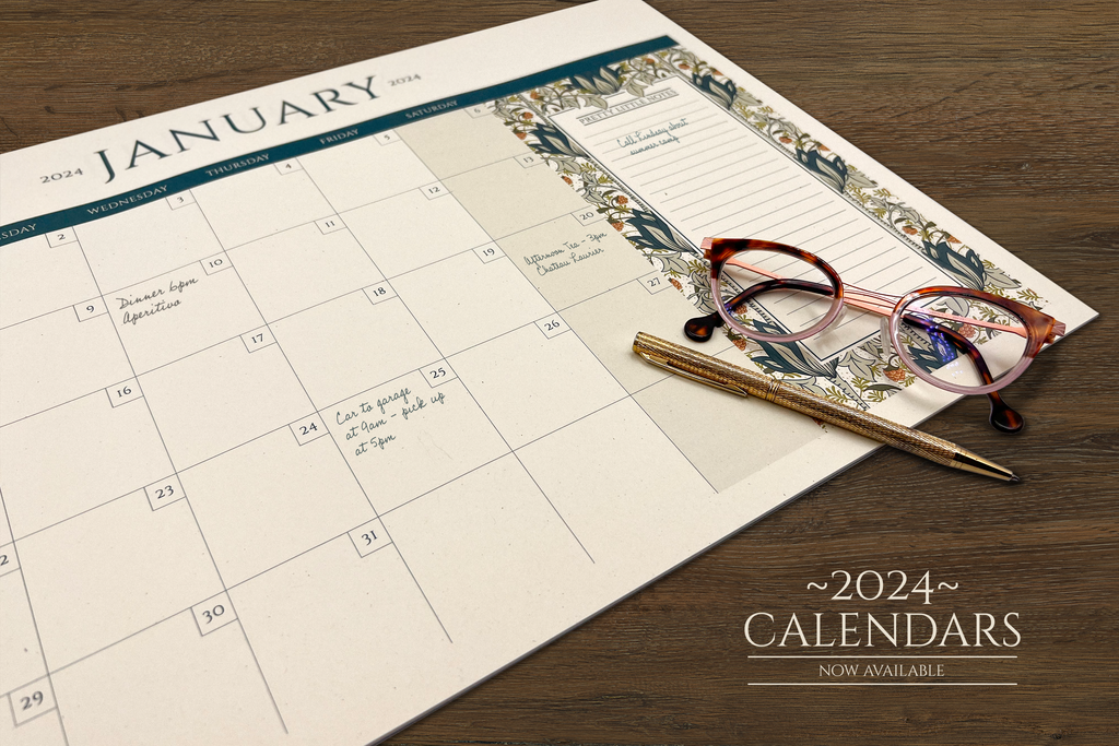 Photo of large 2024, 12-month desktop calendar with botanical floral details.